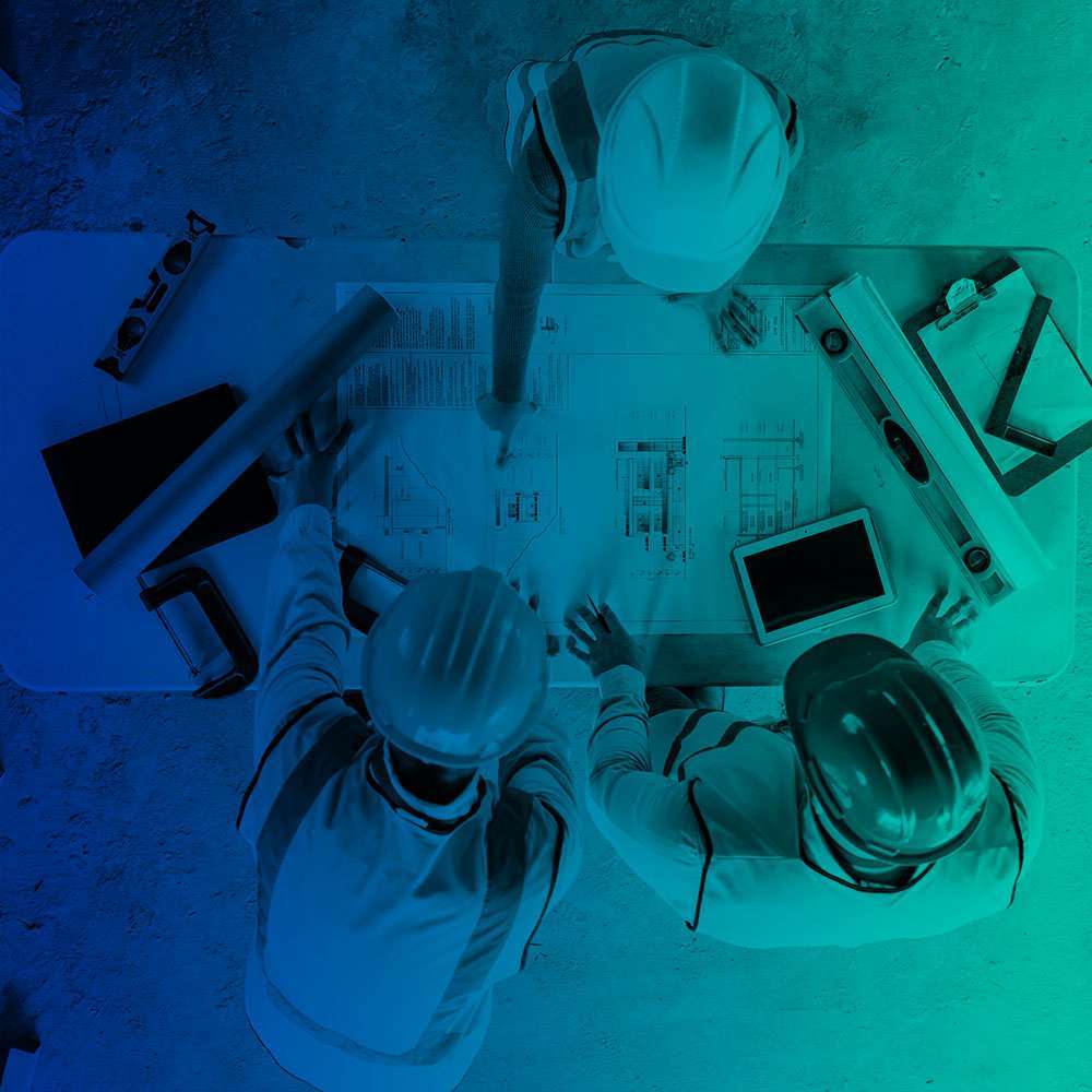 Engineers reviewing construction plans together